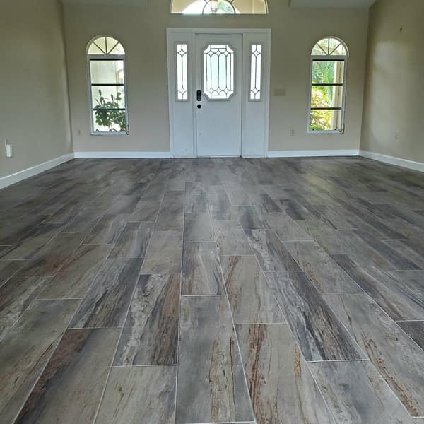 Blue-gray wood-look plank tile floor in an entryway