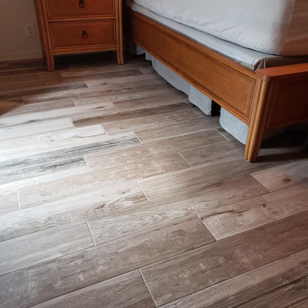 Wood-look plank tile floor in a bedroom