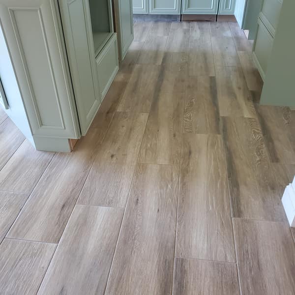 Wood-look plank tile floor along a hallway