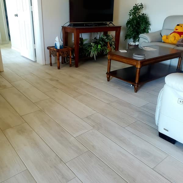 Light wood-look plank tile floor in a living room