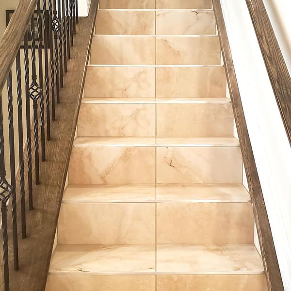 Staircase finished with beige stone-look tile